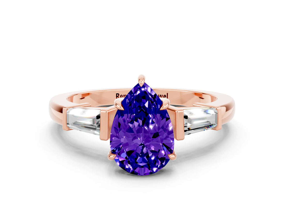 Rose gold Pear Cut Cut Diamond Ring with Tapered Baguette Side Stones in Four-Prong Setting
