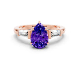 Rose gold Pear Cut Cut Diamond Ring with Tapered Baguette Side Stones in Four-Prong Setting