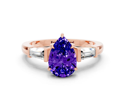 Rose gold Pear Cut Cut Diamond Ring with Tapered Baguette Side Stones in Four-Prong Setting
