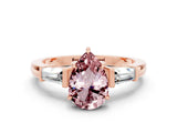 Rose gold Pear Cut Cut Diamond Ring with Tapered Baguette Side Stones in Four-Prong Setting