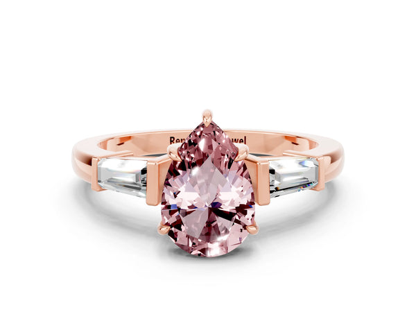 Rose gold Pear Cut Cut Diamond Ring with Tapered Baguette Side Stones in Four-Prong Setting