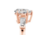 Rose gold Pear Cut Cut Diamond Ring with Tapered Baguette Side Stones in Four-Prong Setting_5
