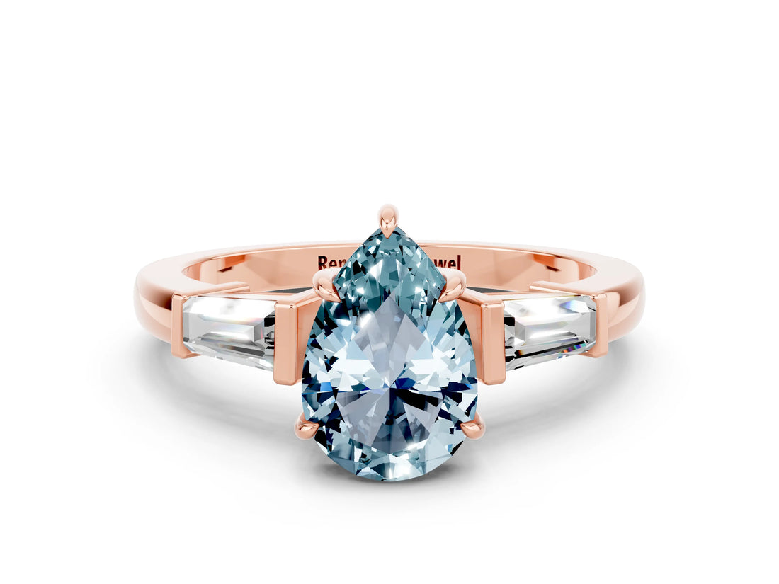 Rose gold Pear Cut Cut Diamond Ring with Tapered Baguette Side Stones in Four-Prong Setting