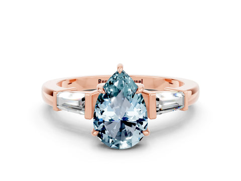 Rose gold Pear Cut Cut Diamond Ring with Tapered Baguette Side Stones in Four-Prong Setting