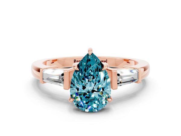 Rose gold Pear Cut Cut Diamond Ring with Tapered Baguette Side Stones in Four-Prong Setting