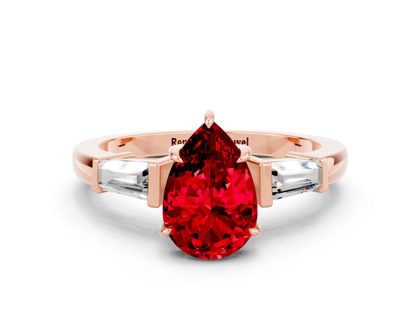 Rose gold Pear Cut Cut Diamond Ring with Tapered Baguette Side Stones in Four-Prong Setting