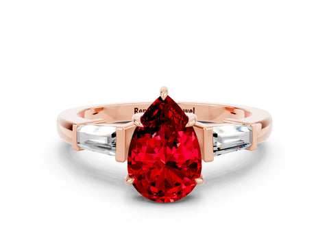 Rose gold Pear Cut Cut Diamond Ring with Tapered Baguette Side Stones in Four-Prong Setting