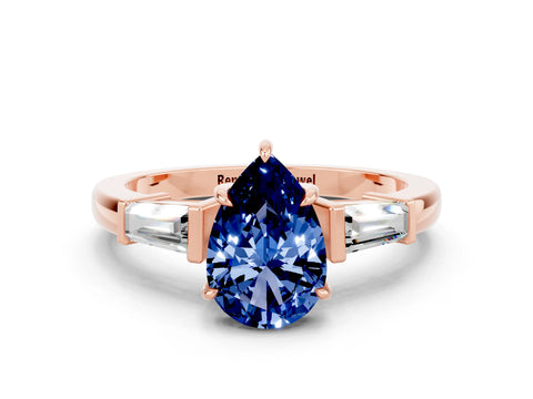 Rose gold Pear Cut Cut Diamond Ring with Tapered Baguette Side Stones in Four-Prong Setting