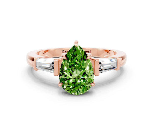 Rose gold Pear Cut Cut Diamond Ring with Tapered Baguette Side Stones in Four-Prong Setting