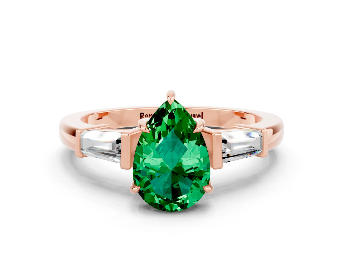 Rose gold Pear Cut Cut Diamond Ring with Tapered Baguette Side Stones in Four-Prong Setting