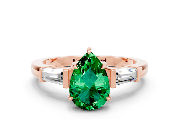 Rose gold Pear Cut Emerald Three-Stone Ring with Tapered Baguette Side Stones and Prong Setting
