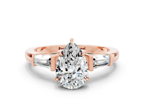 Rose gold Pear Cut Cut Diamond Ring with Tapered Baguette Side Stones in Four-Prong Setting
