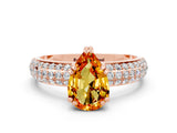 Rose gold Pear Cut Cut Pave Diamond Engagement Ring with Channel Set Band and Four-Prong Setting