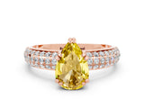 Rose gold Pear Cut Cut Pave Diamond Engagement Ring with Channel Set Band and Four-Prong Setting