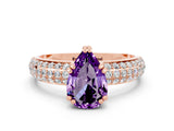 Rose gold Pear Cut Cut Pave Diamond Engagement Ring with Channel Set Band and Four-Prong Setting
