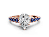 Rose gold Pear Cut Diamond Cathedral Solitaire Ring with Round with Blue Sapphire side stone Pavé Band_12