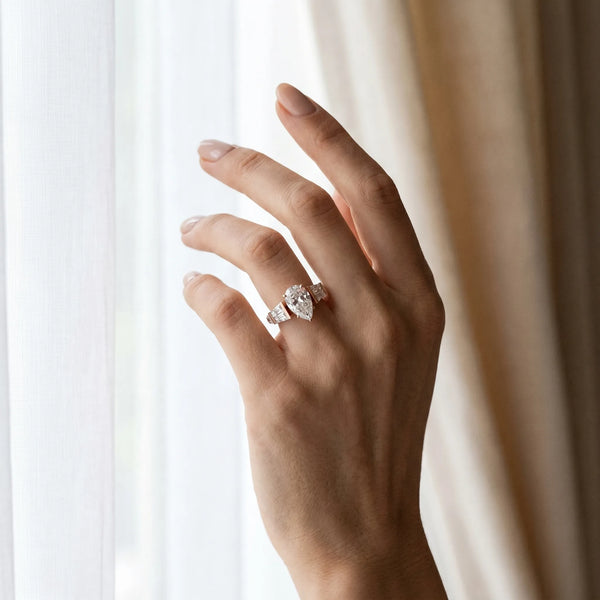 Rose gold Pear Cut Diamond Engagement Ring with Baguette Side Stones and Channel Set Band