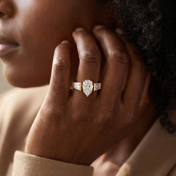 Rose gold Pear Cut Diamond Engagement Ring with Baguette Side Stones and Channel Set Band