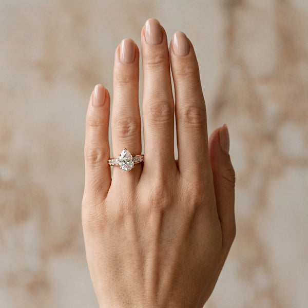 Rose gold Pear Cut Diamond Engagement Ring with Pavé Band and Four-Prong Setting