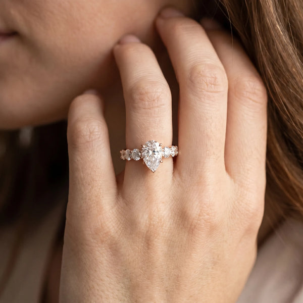 Rose gold Pear Cut Diamond Engagement Ring with Pavé Band and Four-Prong Setting