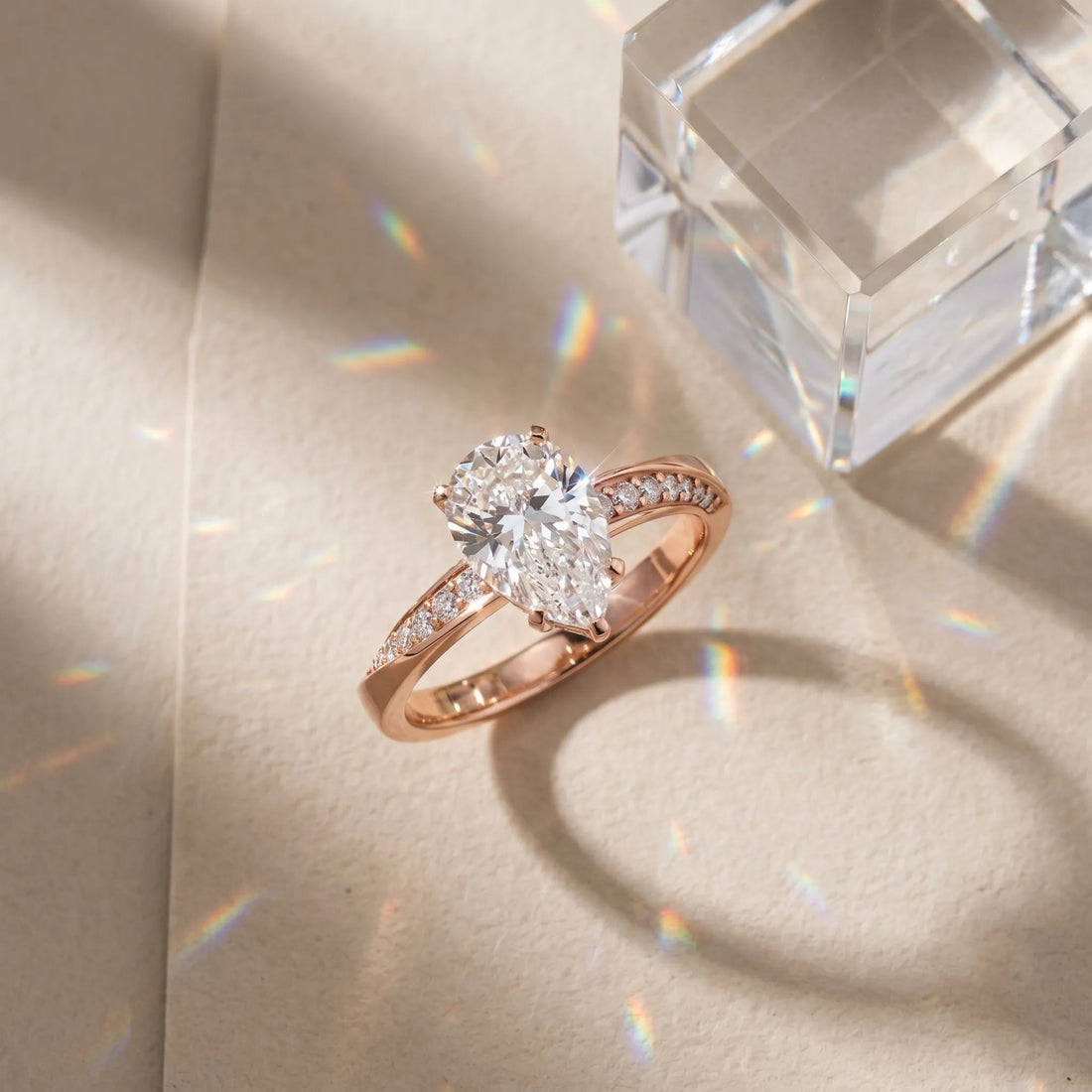 Rose gold Pear Cut Diamond Engagement Ring with Side Stone Accents and Four-Prong Setting_16
