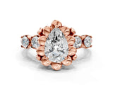 Rose gold Pear Cut Diamond Floral Halo Engagement Ring with Shared Prong Setting
