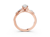 Rose gold Pear Cut Diamond Ring with Baguette Side Stones, Channel Set Band, and Four-Prong Setting_28