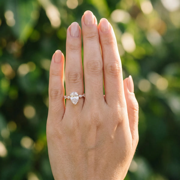 Rose gold Pear Cut Diamond Ring with Marquise Side Stones and Prong Setting