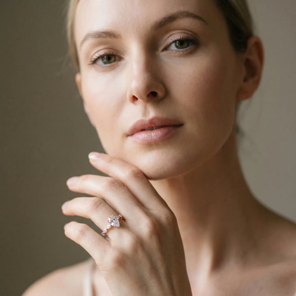 Rose gold Pear Cut Diamond Ring with Marquise Side Stones and Prong Setting