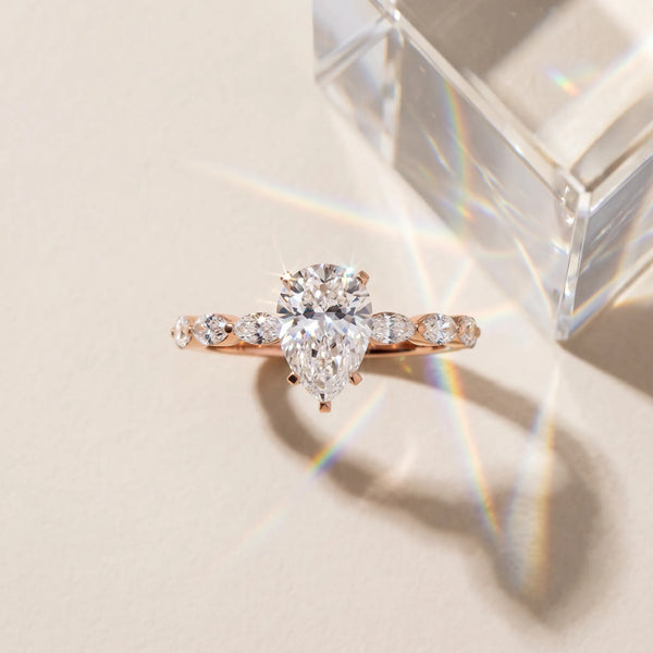 Rose gold Pear Cut Diamond Ring with Marquise Side Stones and Prong Setting