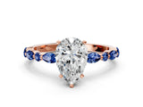 Rose gold Pear Cut Diamond Ring with Marquise and Round with Blue Sapphire side stone Side Stones and Four-Prong Setting_48