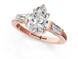 Rose gold Pear Cut Diamond Ring with Tapered Baguette Side Stones in Four-Prong Setting_17