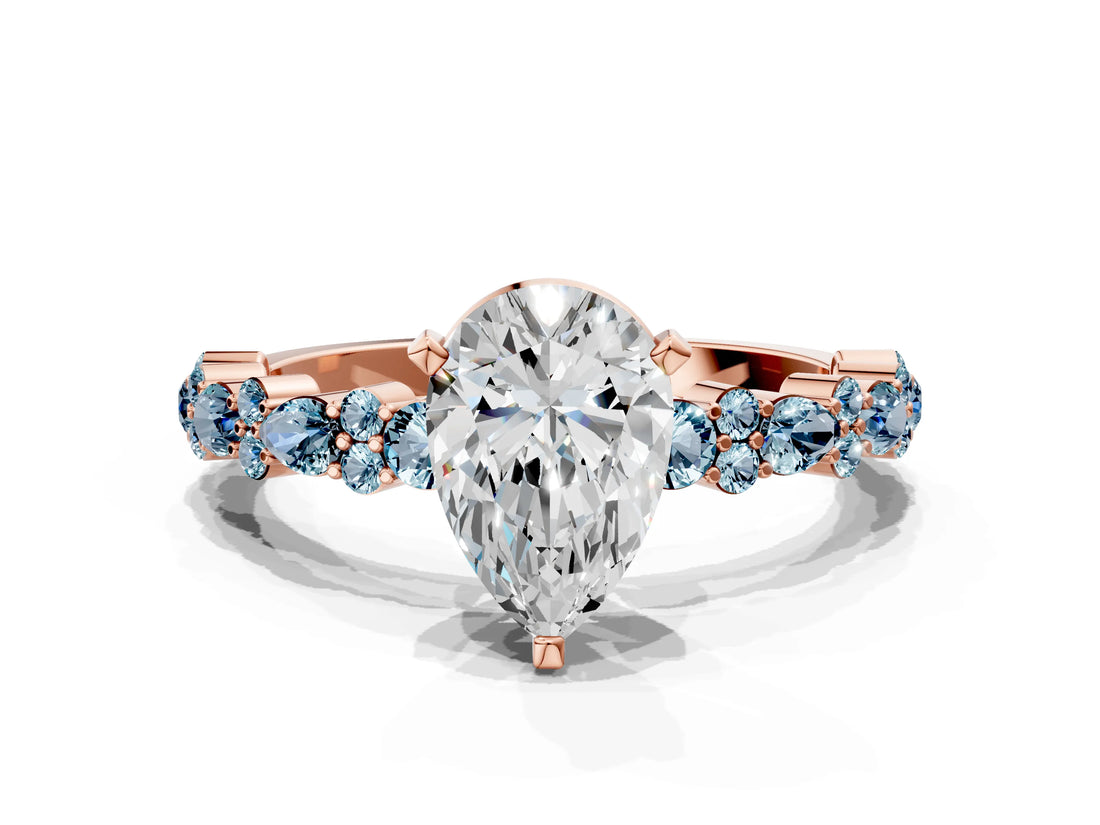 Rose gold Pear Cut Diamond Side Stone Solitaire Ring with Round with Aquamarine side stone and Four-Prong Setting