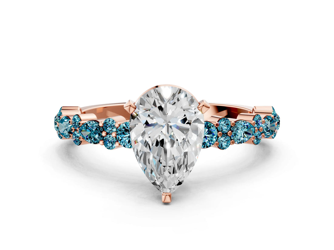 Rose gold Pear Cut Diamond Side Stone Solitaire Ring with Round with Blue Topaz side stone and Four-Prong Setting