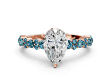 Rose gold Pear Cut Diamond Side Stone Solitaire Ring with Round with Blue Topaz side stone and Four-Prong Setting