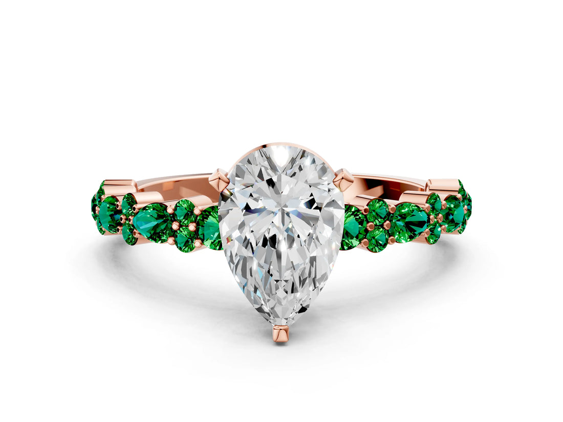 Rose gold Pear Cut Diamond Side Stone Solitaire Ring with Round with Emerald side stone and Four-Prong Setting