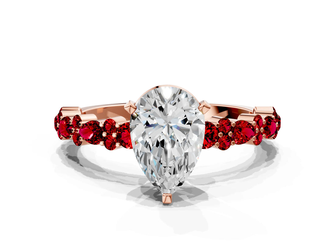 Rose gold Pear Cut Diamond Side Stone Solitaire Ring with Round with Ruby side stone and Four-Prong Setting