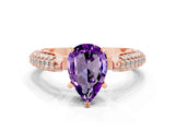 Rose gold Pear Cut Diamond Solitaire Engagement Ring with Pavé Band and Four-Prong Setting