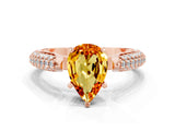 Rose gold Pear Cut Diamond Solitaire Engagement Ring with Pavé Band and Four-Prong Setting