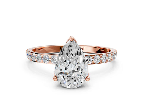Rose gold Pear Cut Diamond Solitaire Engagement Ring with Round with Moissanite side stone Pavé Band and Prong Setting