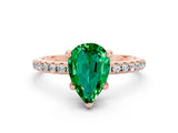 Rose gold Pear Cut Diamond Solitaire Ring with Four-Prong Setting and Pavé Band
