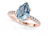 Rose gold Pear Cut Diamond Solitaire Ring with Four-Prong Setting and Pavé Band_1