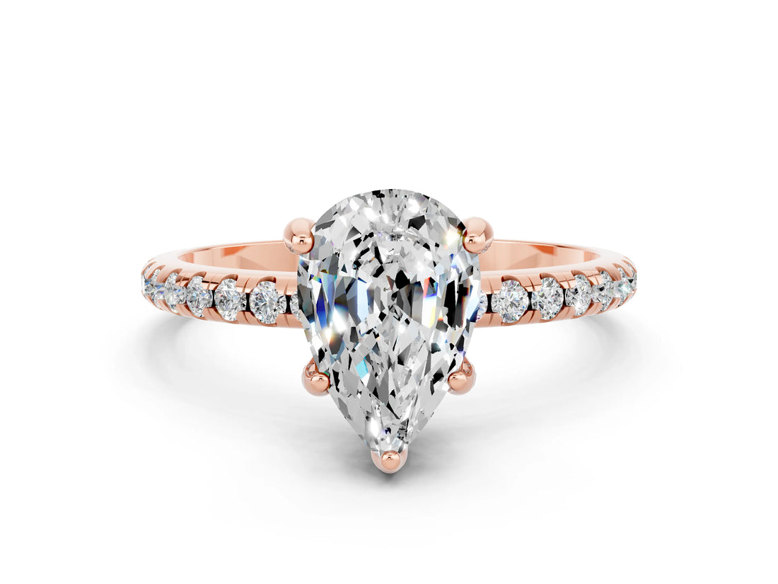 Rose gold Pear Cut Diamond Solitaire Ring with Four-Prong Setting and Pavé Band
