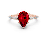 Rose gold Pear Cut Diamond Solitaire Ring with Four-Prong Setting and Pavé Band