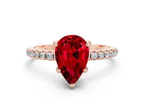 Rose gold Pear Cut Diamond Solitaire Ring with Four-Prong Setting and Pavé Band