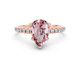 Rose gold Pear Cut Diamond Solitaire Ring with Four-Prong Setting and Pavé Band