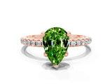 Rose gold Pear Cut Diamond Solitaire Ring with Four-Prong Setting and Pavé Band