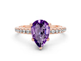Rose gold Pear Cut Diamond Solitaire Ring with Four-Prong Setting and Pavé Band