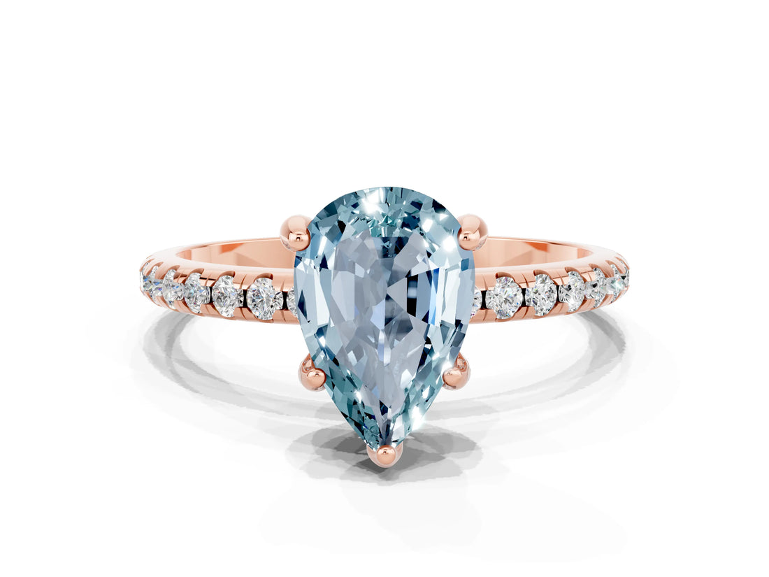 Rose gold Pear Cut Diamond Solitaire Ring with Four-Prong Setting and Pavé Band
