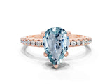 Rose gold Pear Cut Diamond Solitaire Ring with Four-Prong Setting and Pavé Band